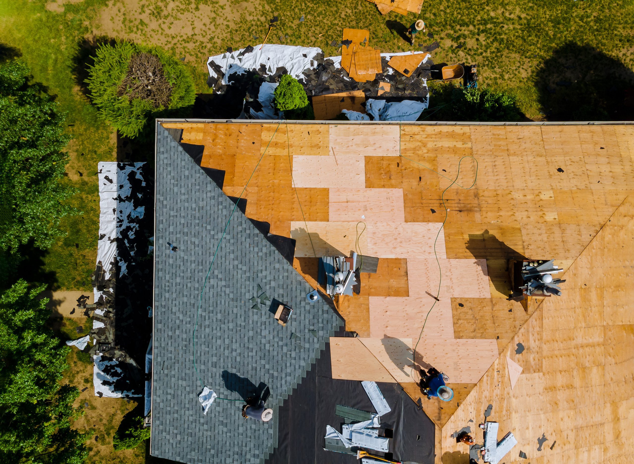 image shows roofers working